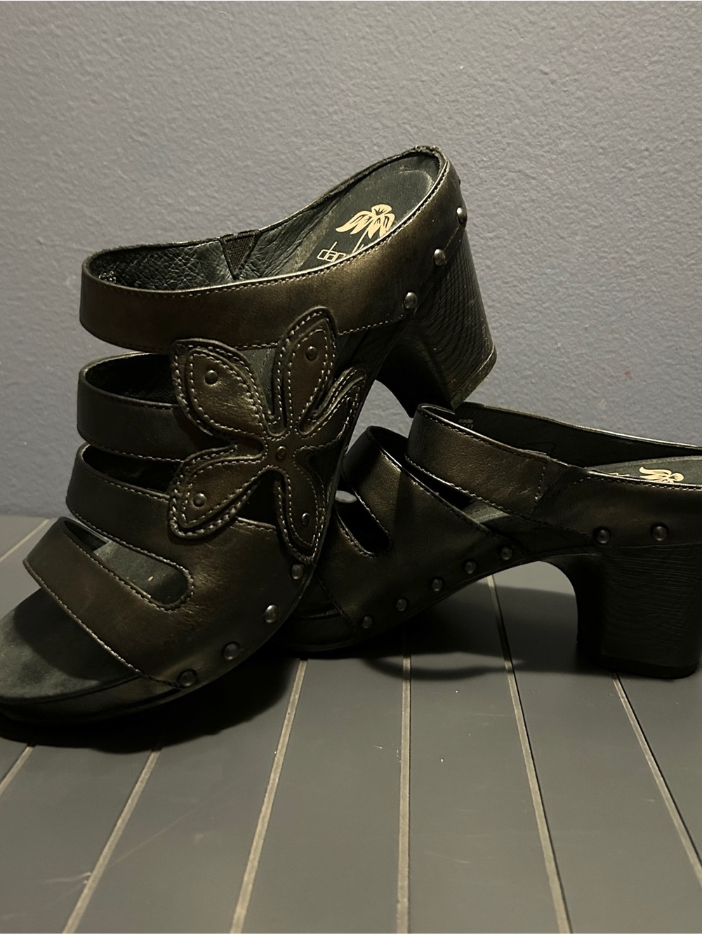 Dansko Genuine Leather Upper Black Floral Appliqué Clog Heels